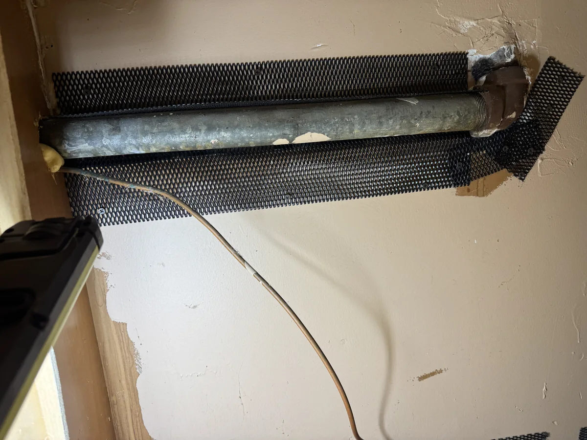 Interior wall opening secured with proofing material in Throgs Neck Bronx